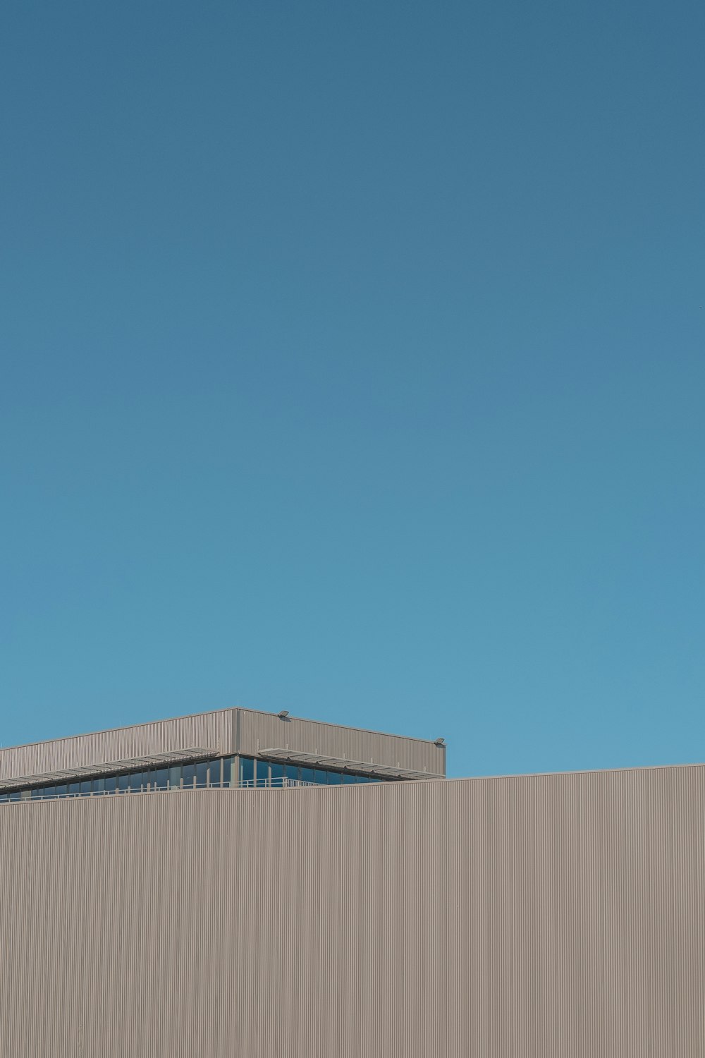 brown building under blue sky