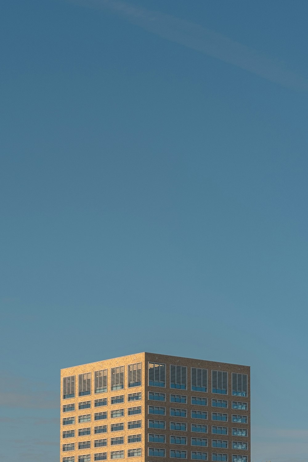 brown building under blue sky