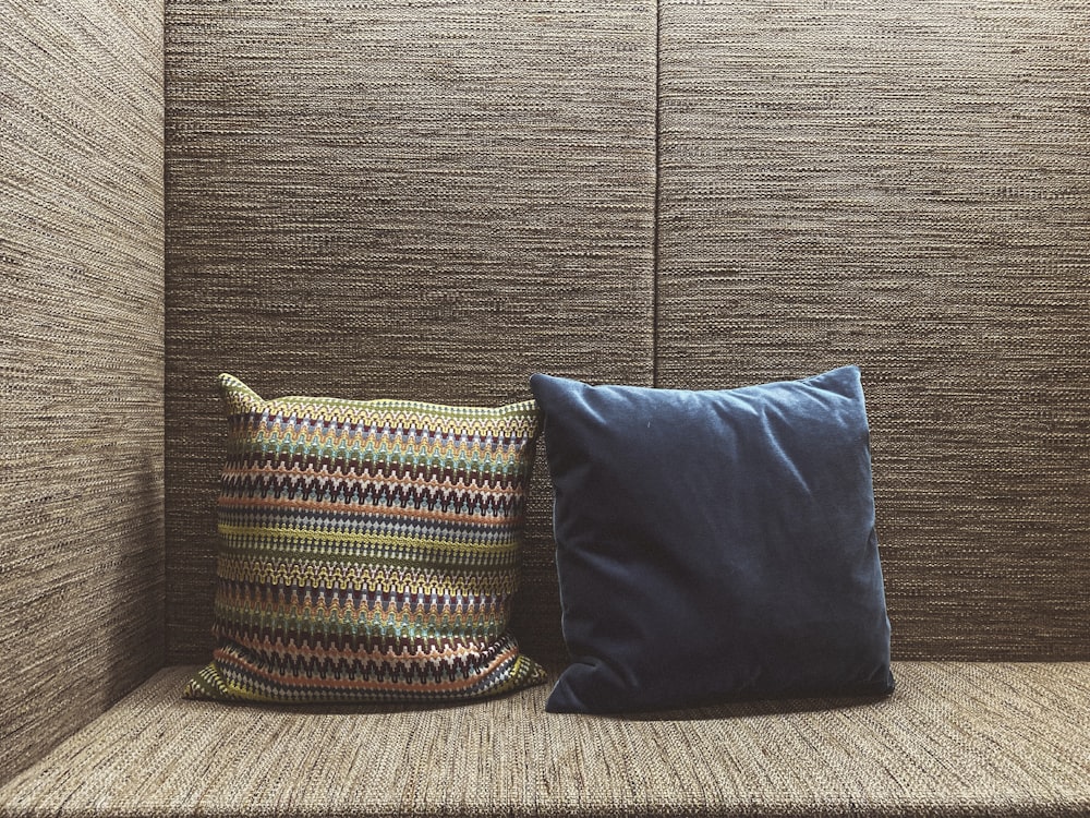 two brown and blue throw pillows