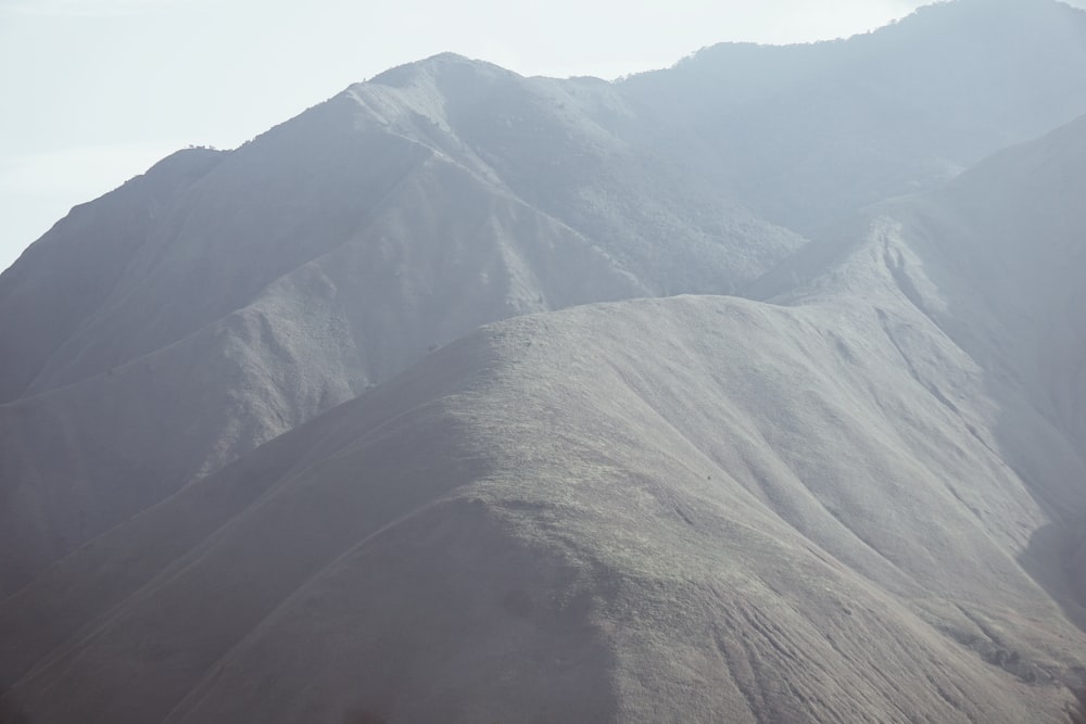 brown and gray mountains under white sky during daytime