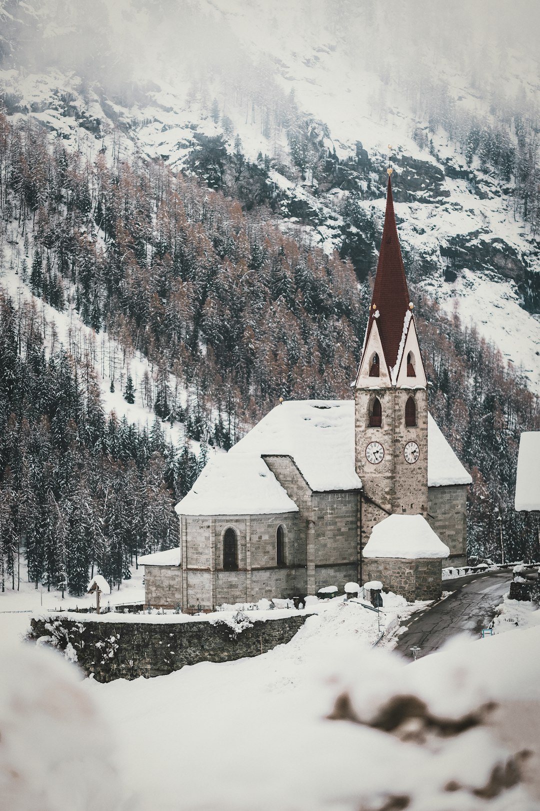 aerial photography of a cathedral covered with snow