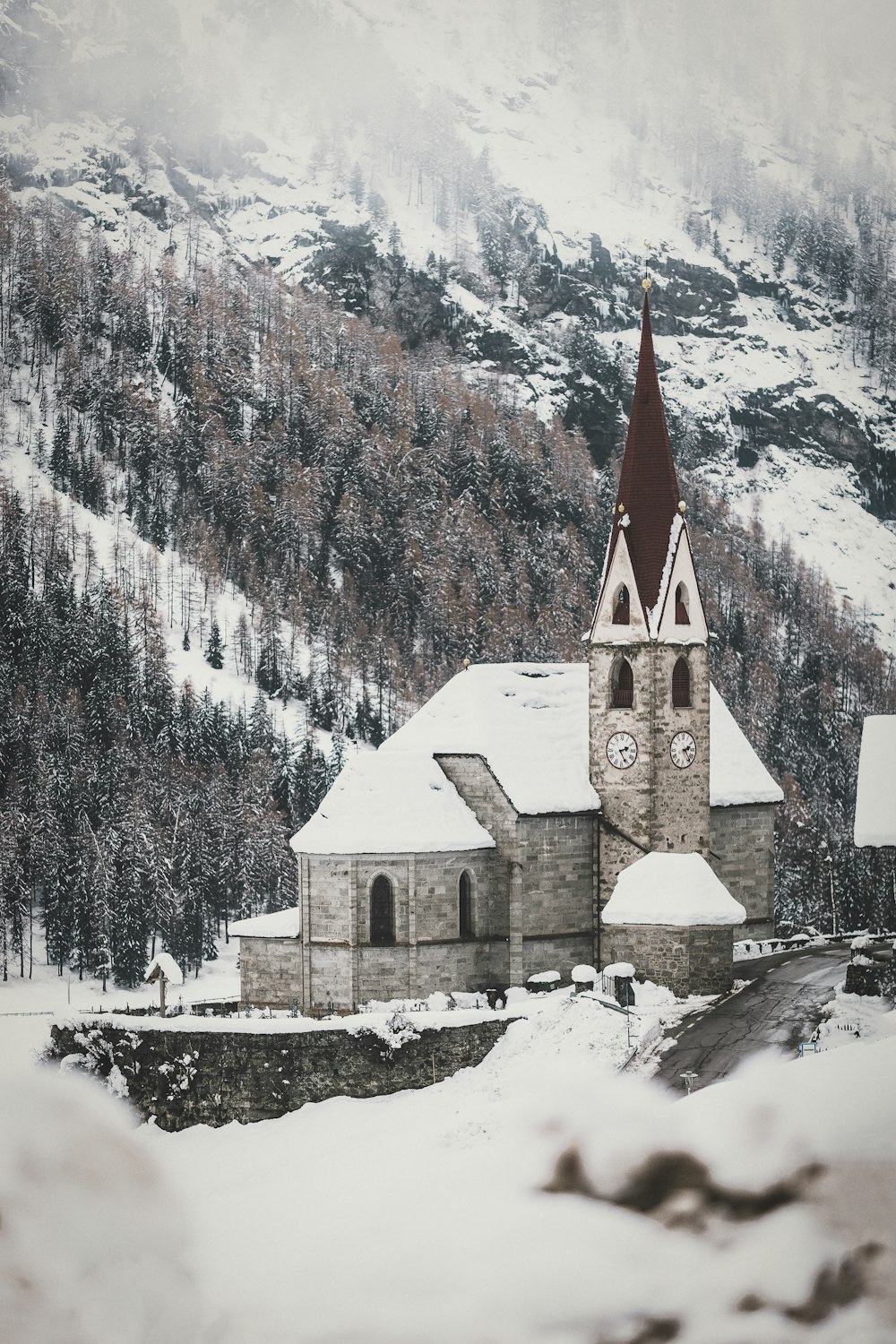 aerial photography of a cathedral covered with snow