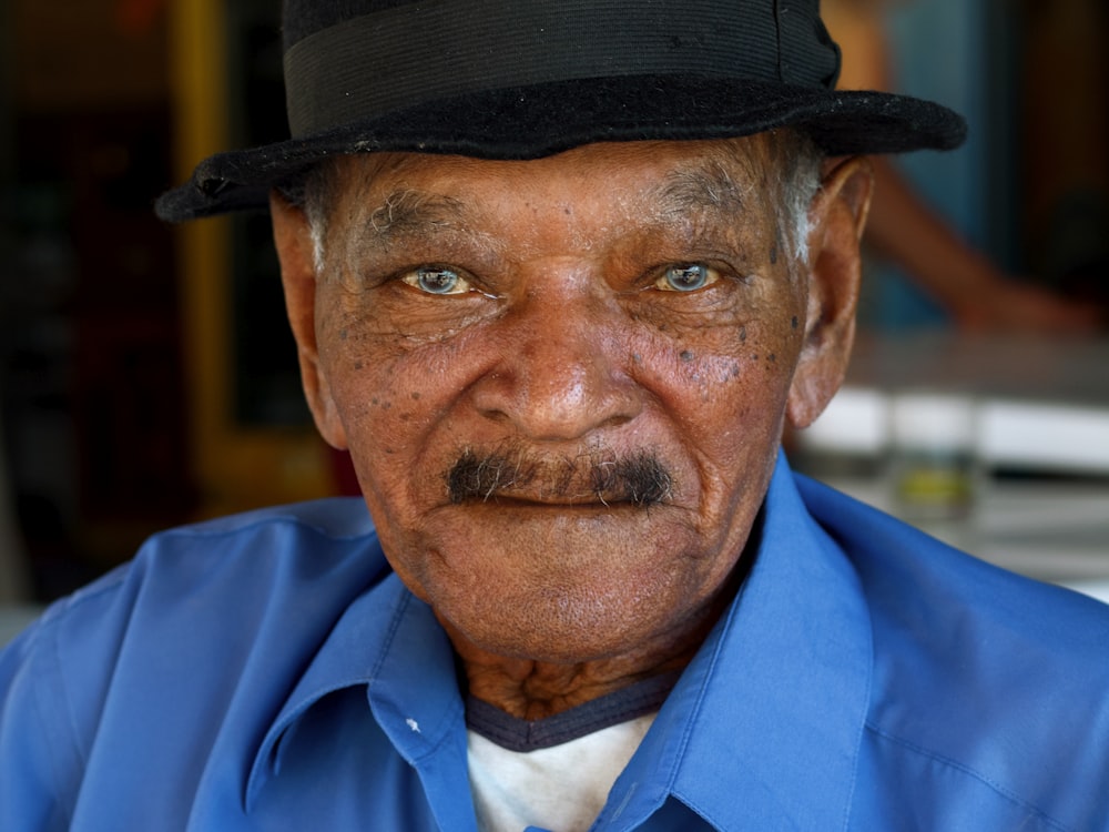 man wearing blue collared shirt