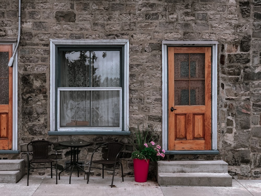 black metal patio set outdoor in front of house