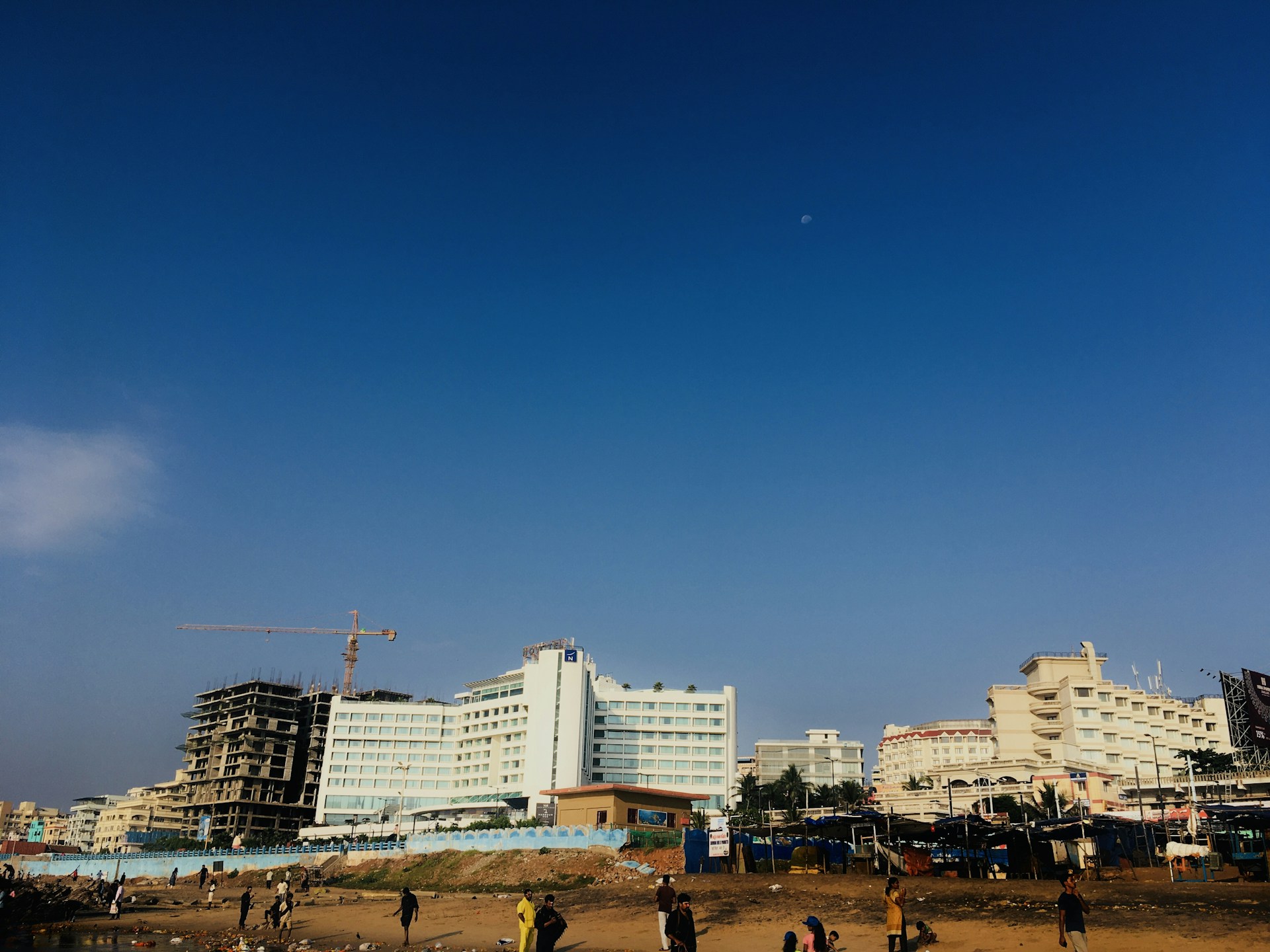 woman wearing yellow long-sleeved dress under white clouds and blue sky during daytime