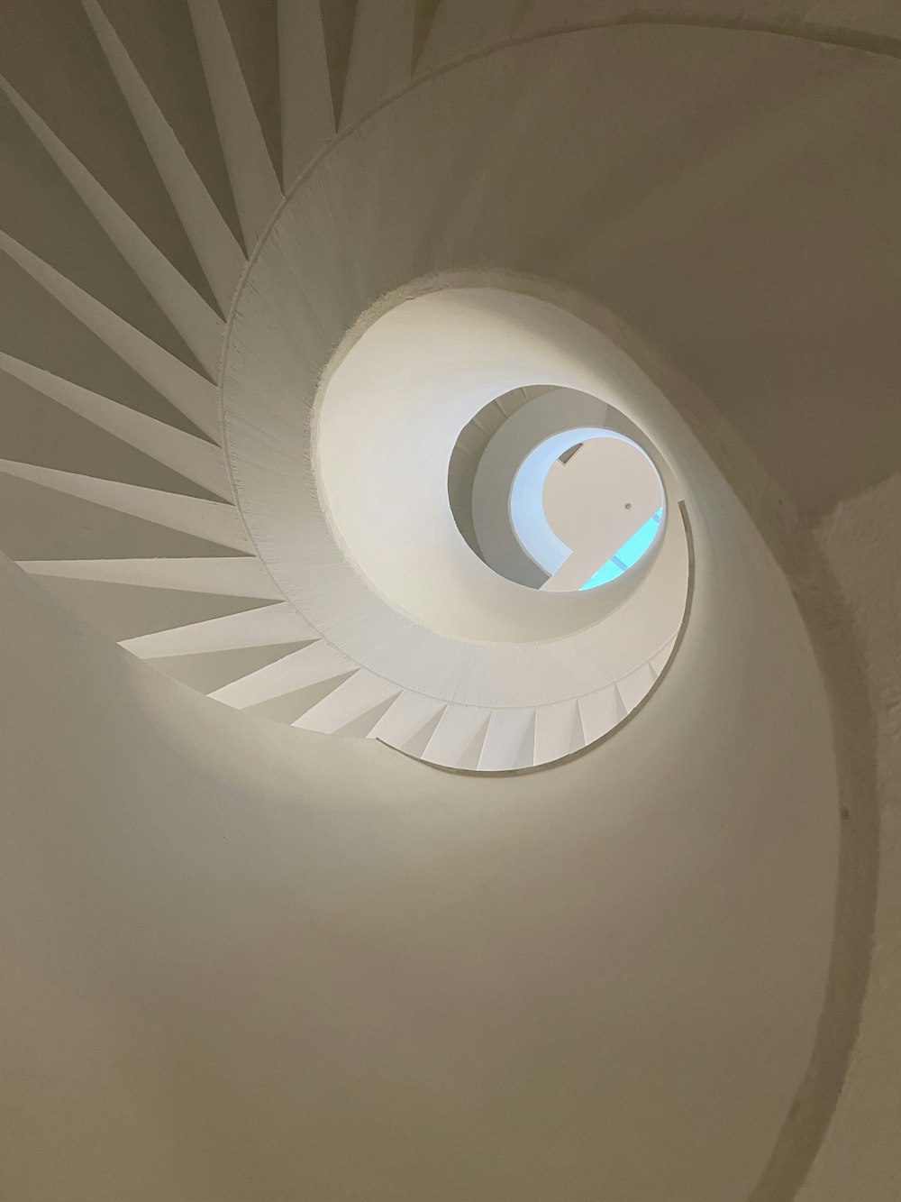 low-angle photography of round stairs