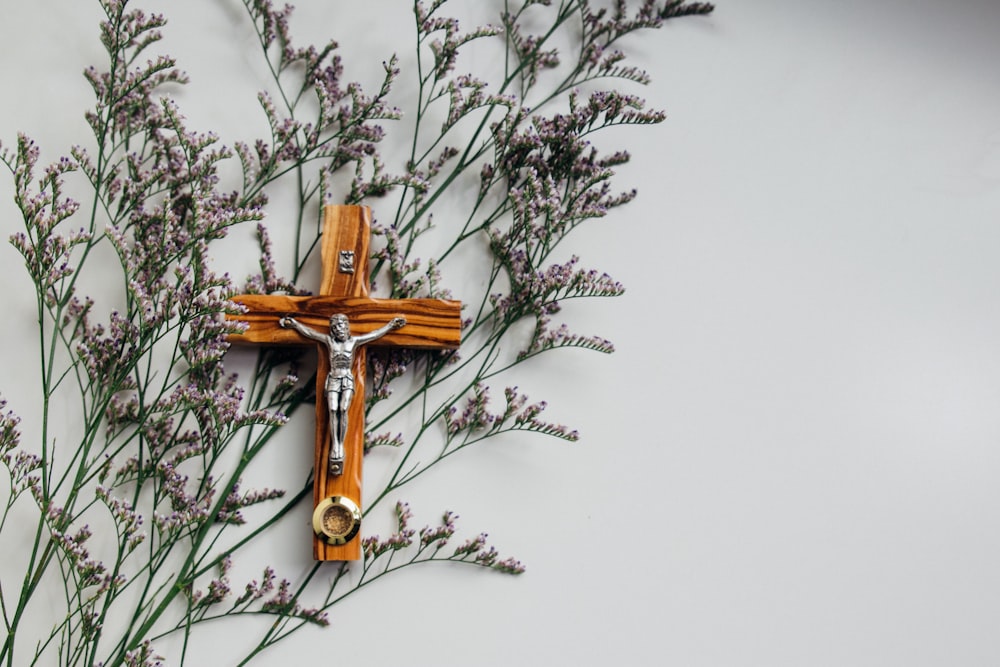 crucifix on wall with flowers
