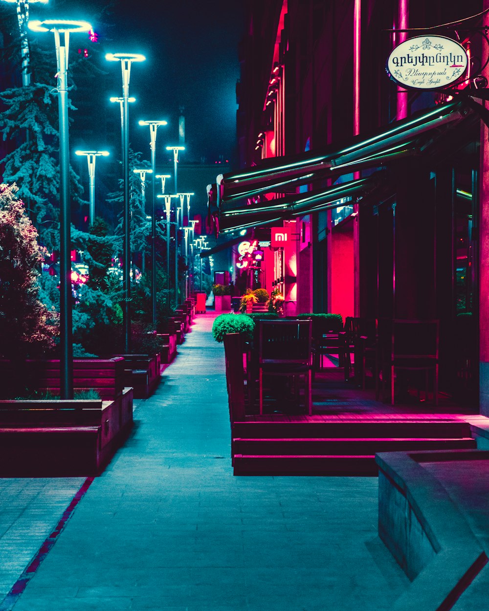 shops and lampposts during night
