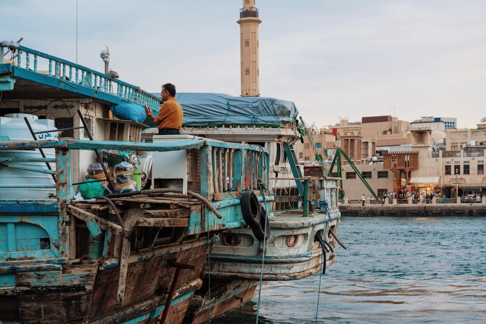 man standing on the boat