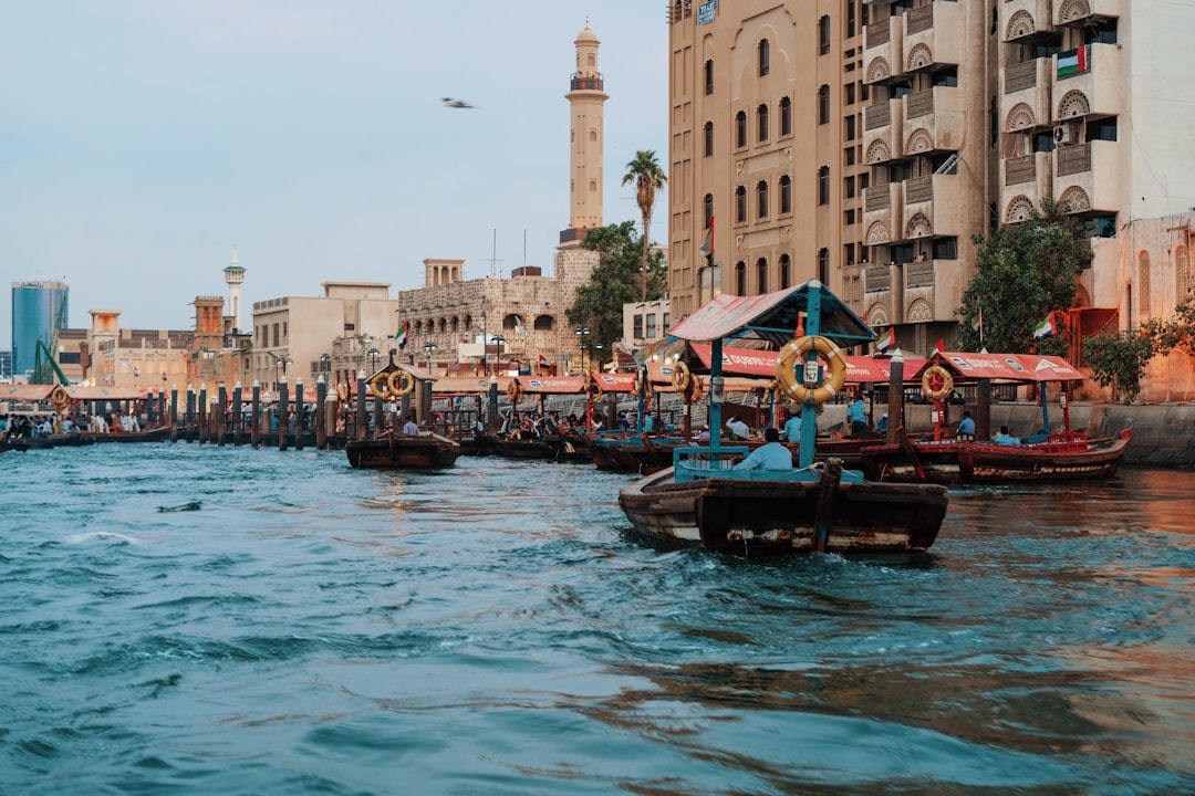 boats near buildings during day