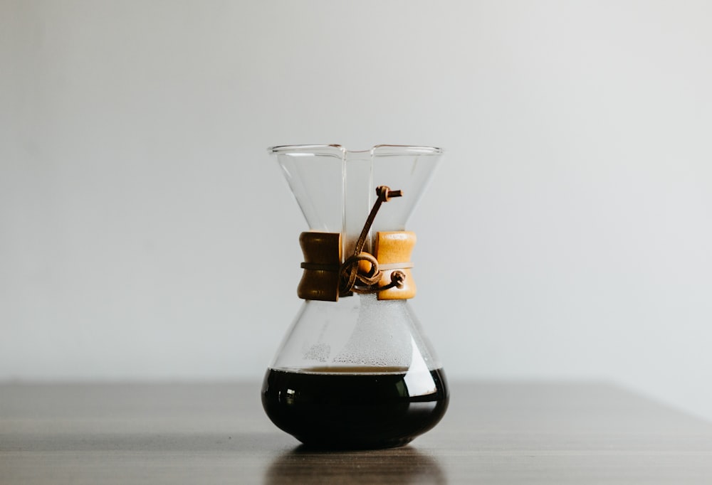 clear glass decanter filled with black liquid