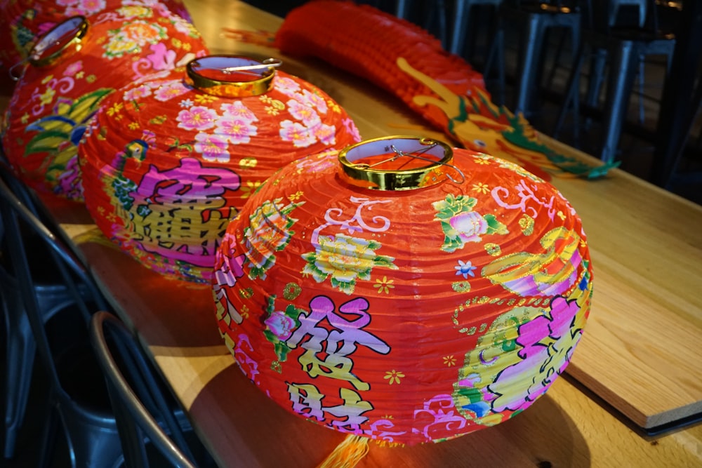 three red-and-pink chinese lanterns