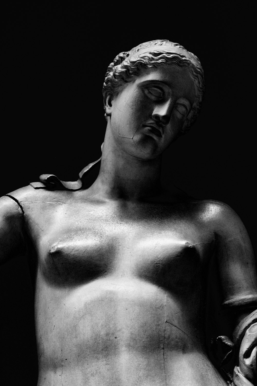 grayscale photo of woman statue