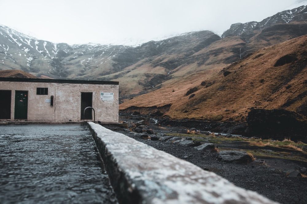 a building in the middle of a mountain range