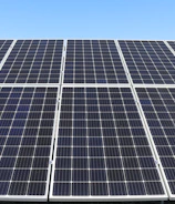 Solar panels gleaming under the sun at a renewable energy facility.
