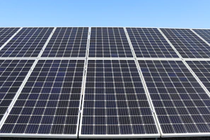 A modern distributed photovoltaic power station under clear blue sky.