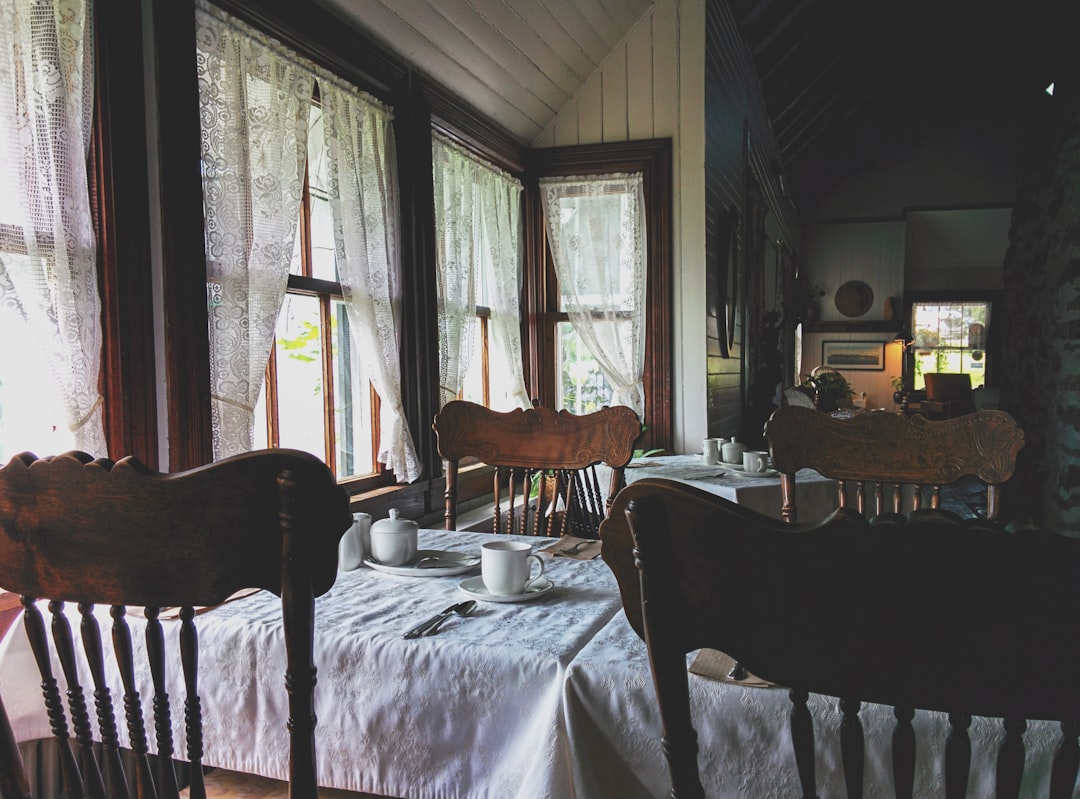 four chairs and tables with mug