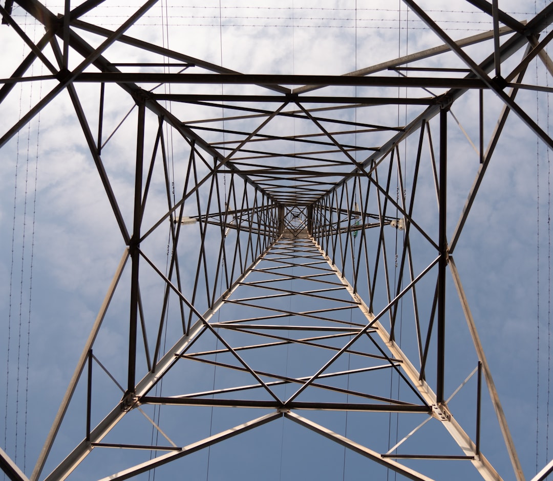 low-angle photography of gray metal tower