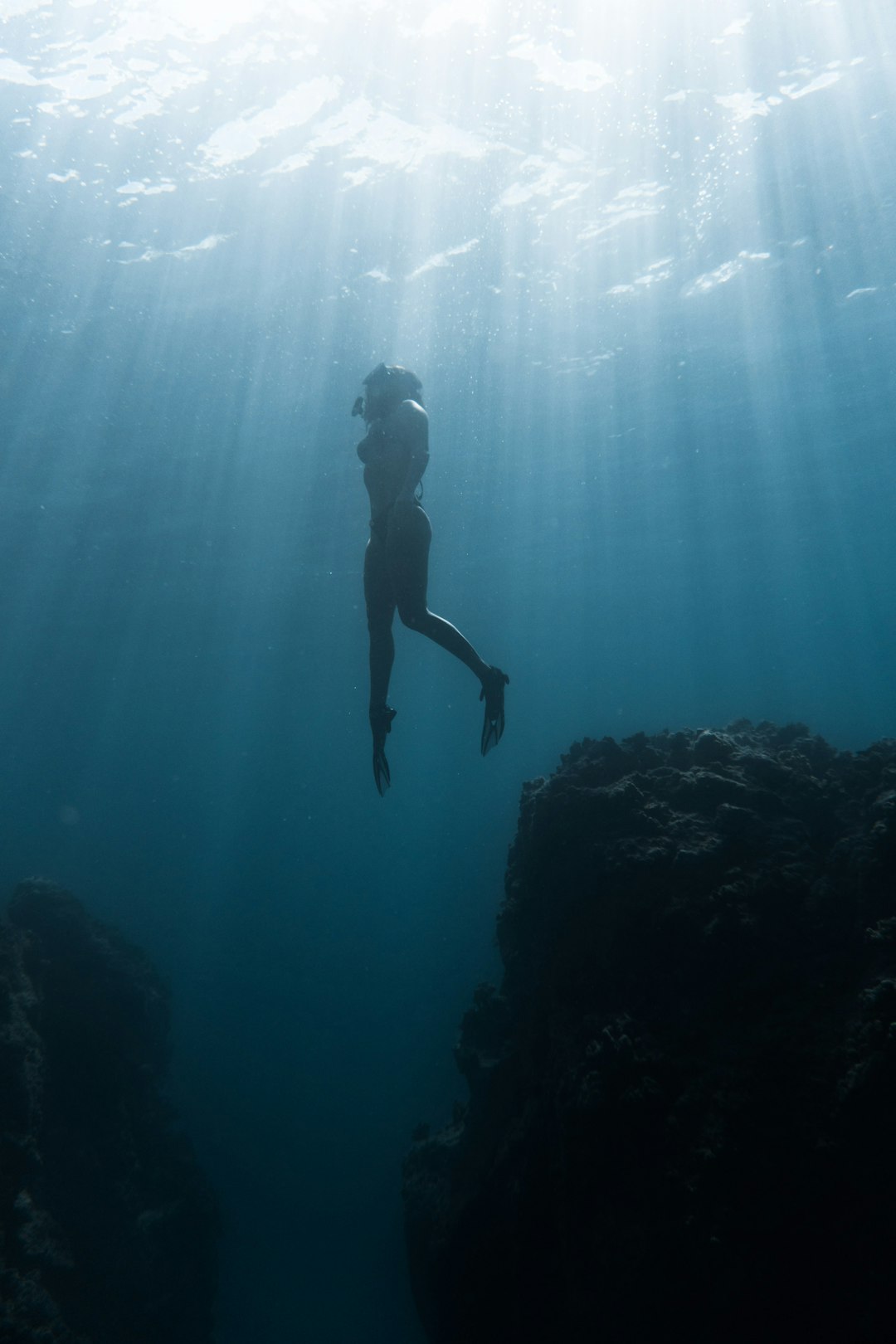 person swimming underweater