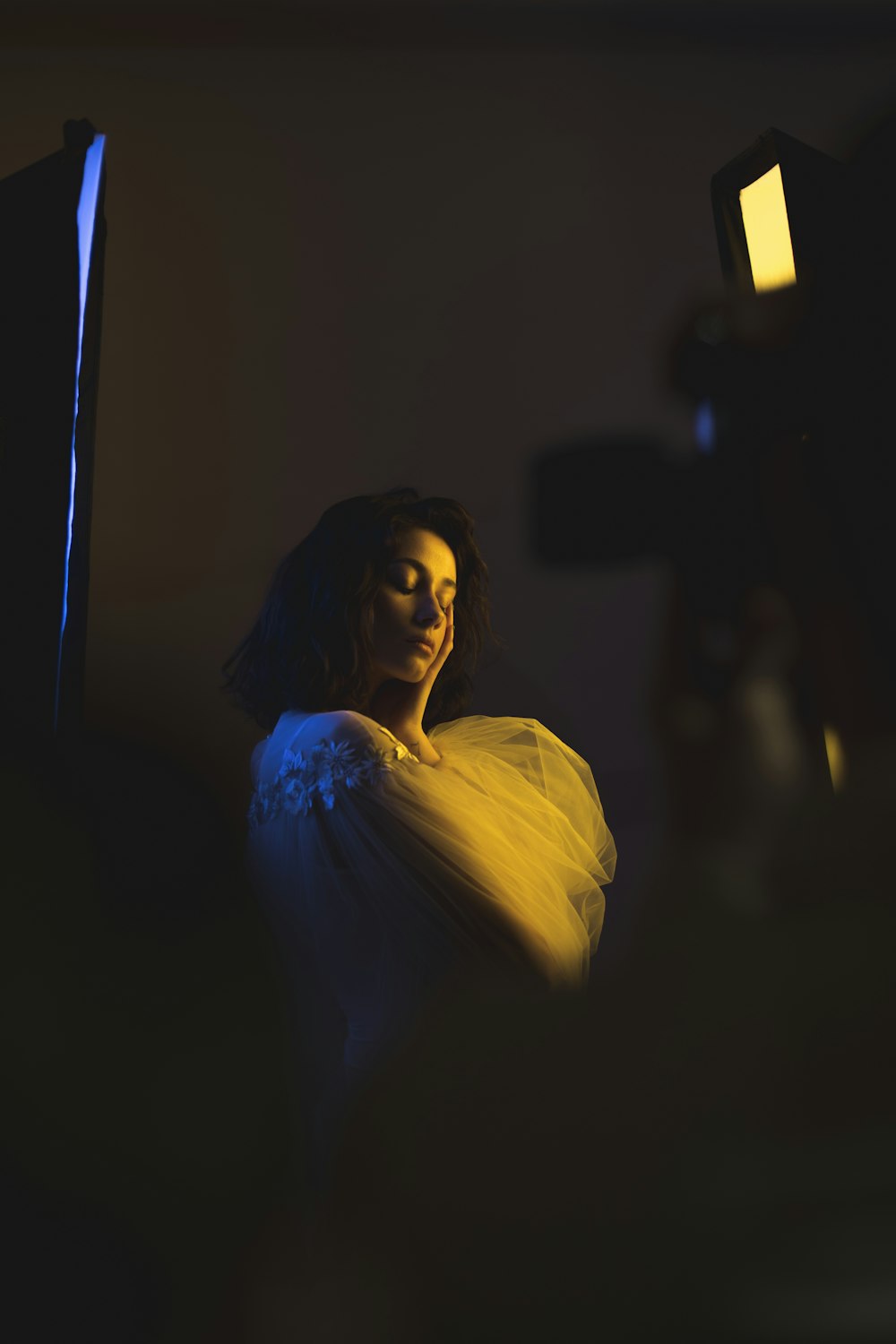 selective focus photography of woman wearing white long-sleeved dress