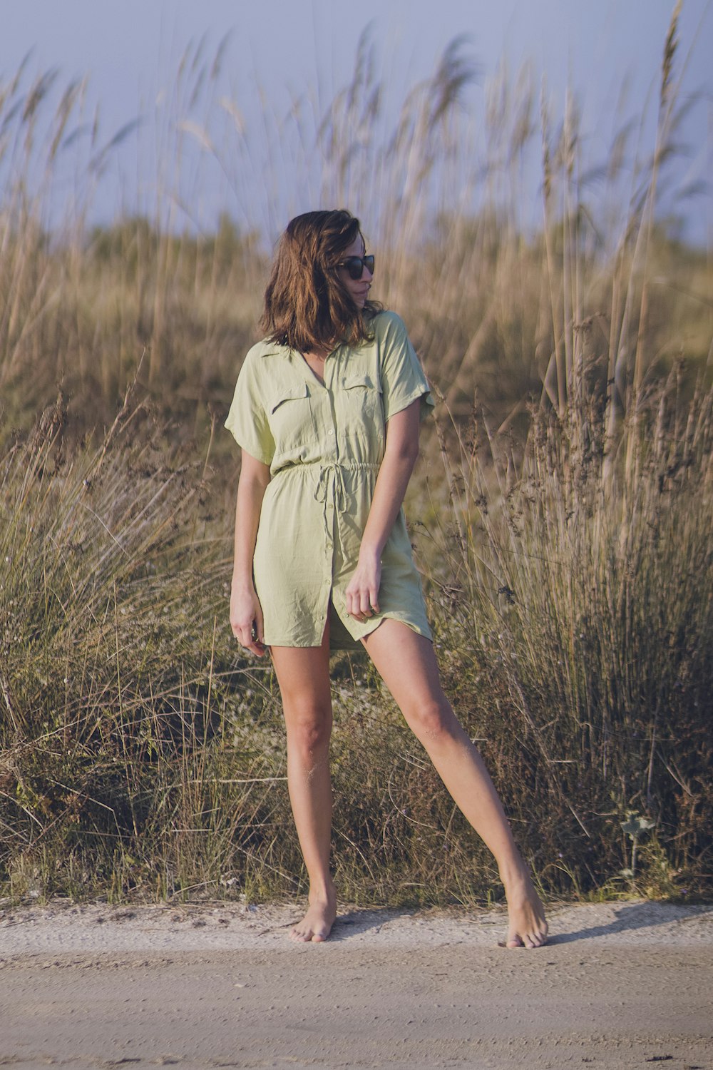 woman standing near grass