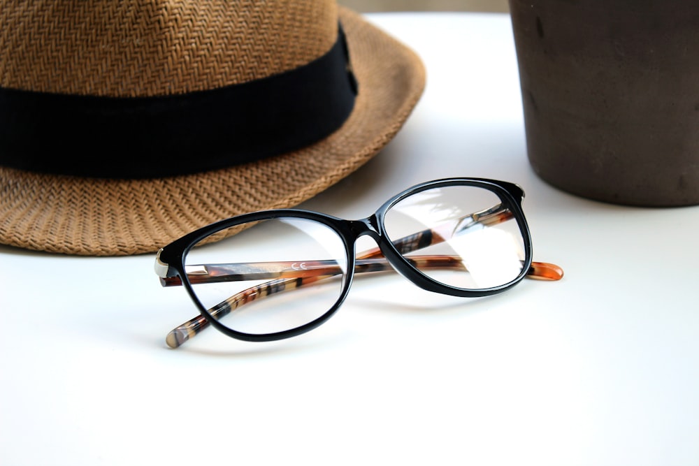 black-framed eyeglasses on white surface