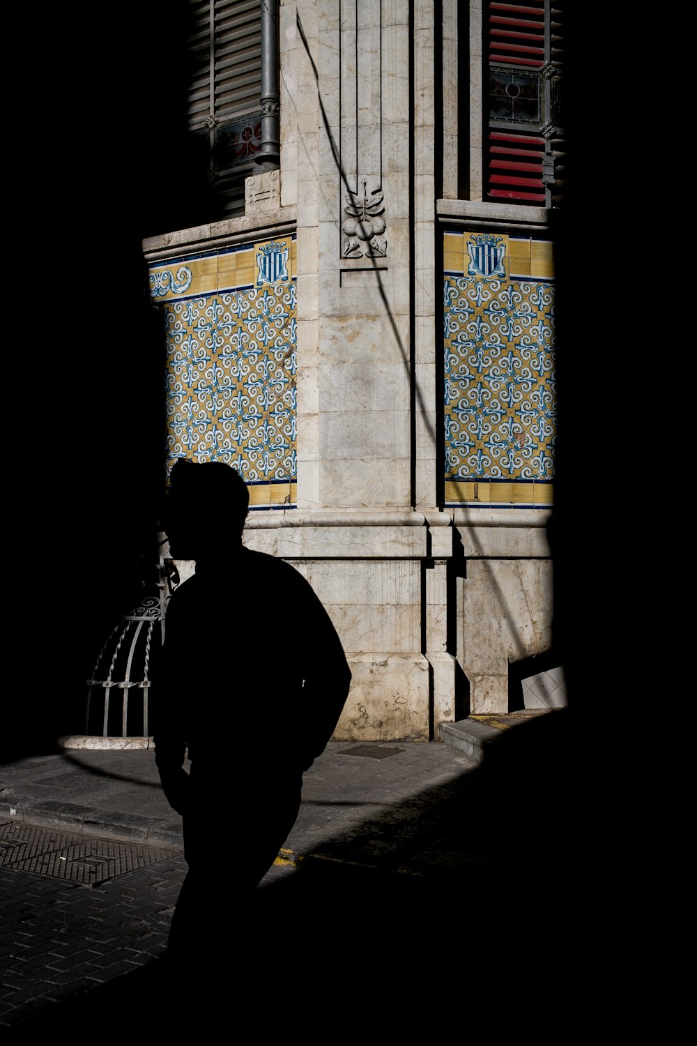 man walking near building