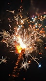Close-up of colorful firework sparks lighting up a festive event.