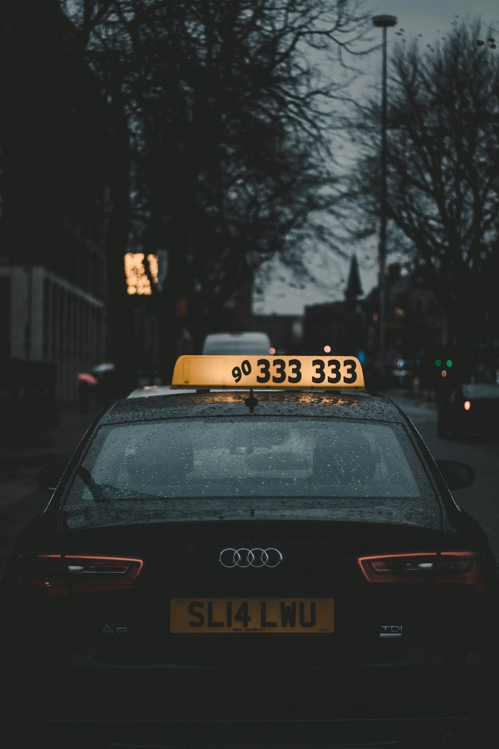 black Audi taxi cab at night