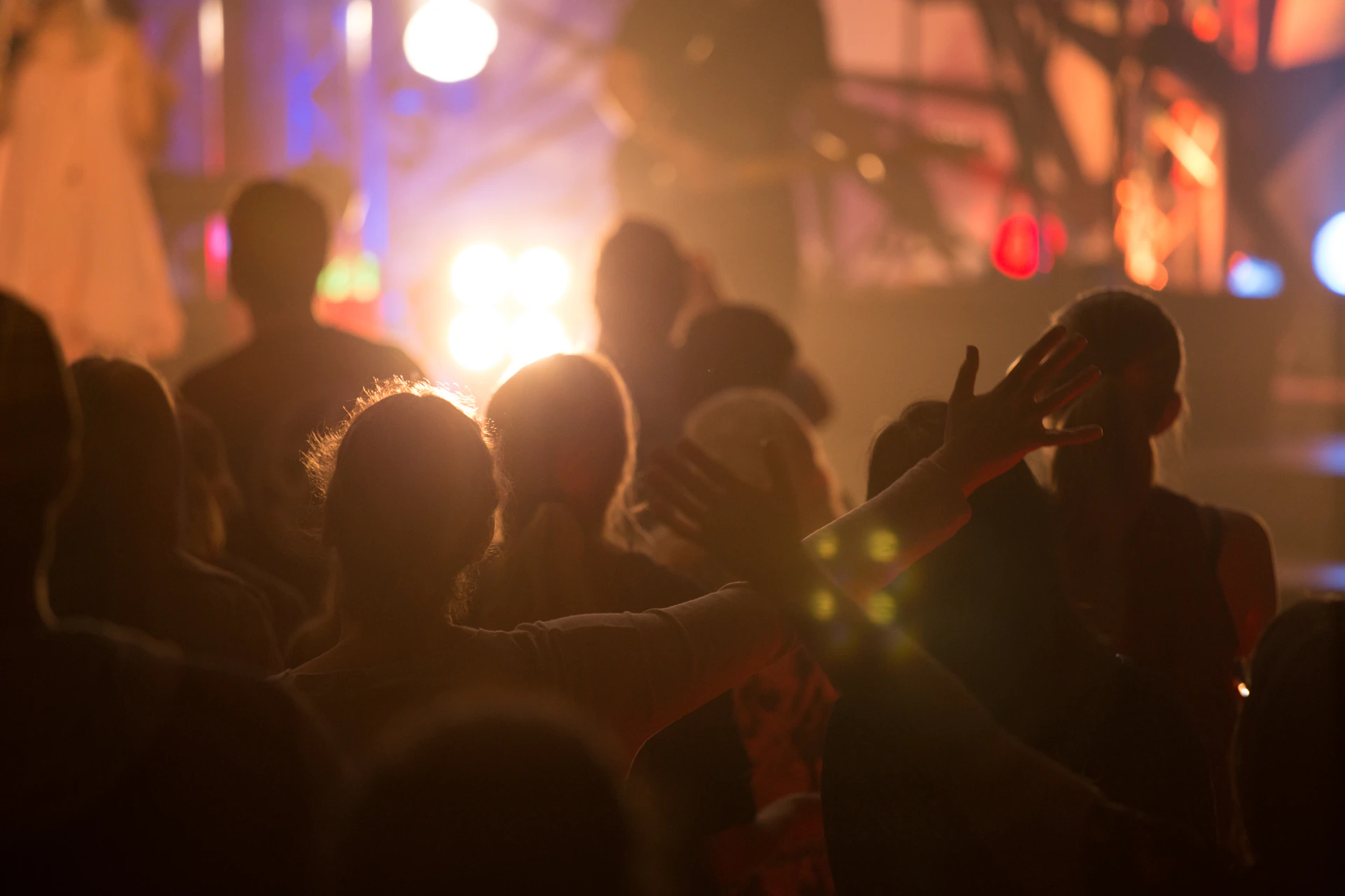 selective focus photo of group of people under the lights