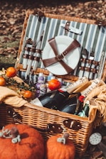 A close-up of a picnic basket filled with fresh fruit and artisanal snacks.