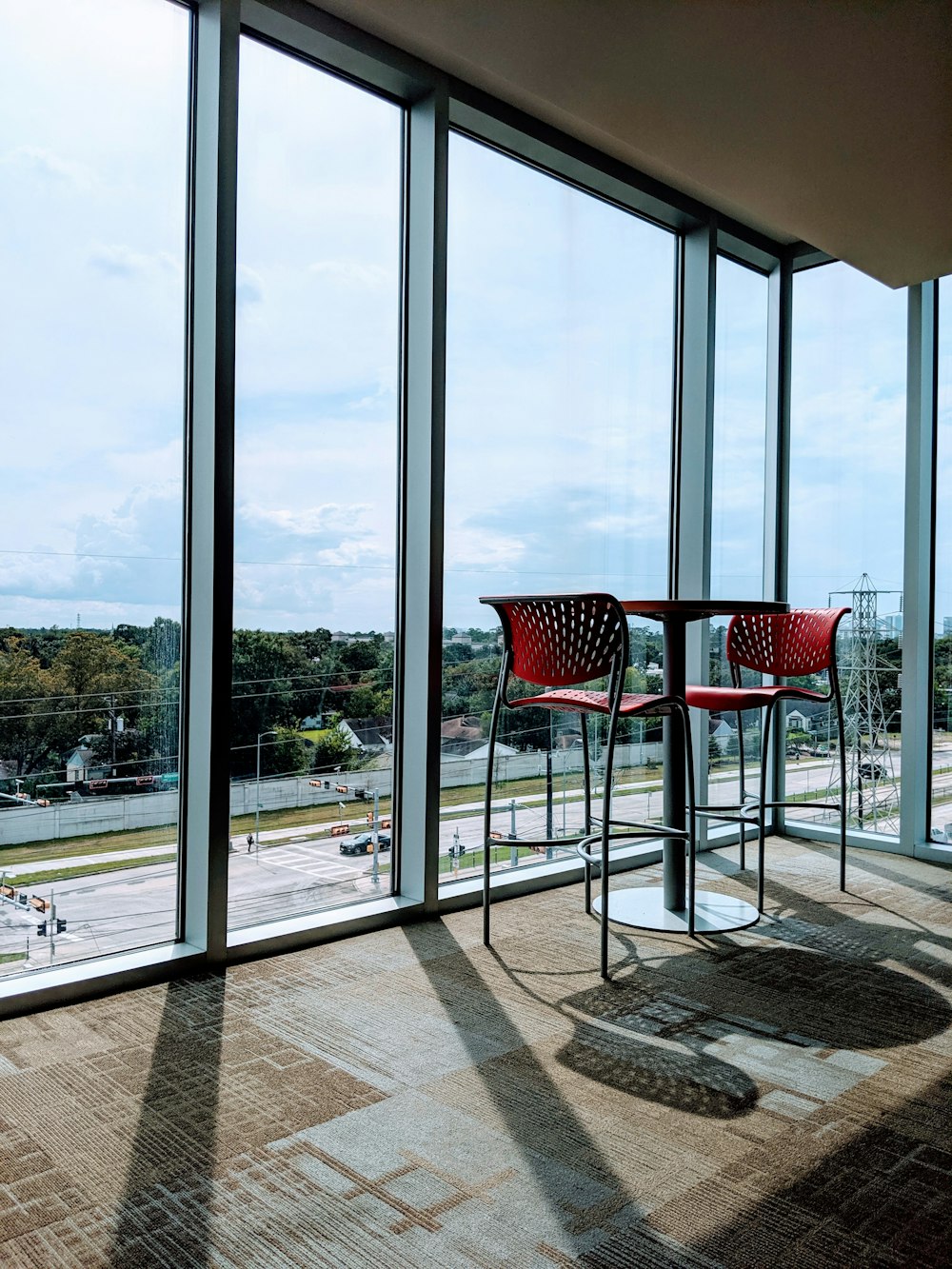 black table near glass wall