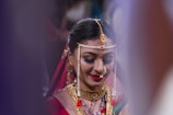 woman wearing gold-colored necklace