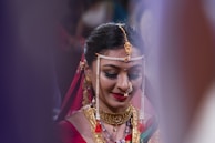 woman wearing gold-colored necklace