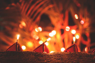 Close-up of glowing energy candles surrounded by delicate golden stars and moon symbols.