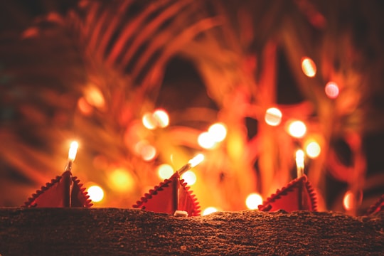 Close-up of elegant decorative LED candles glowing softly in a cozy setting