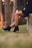 shallow focus photo of person in black booties