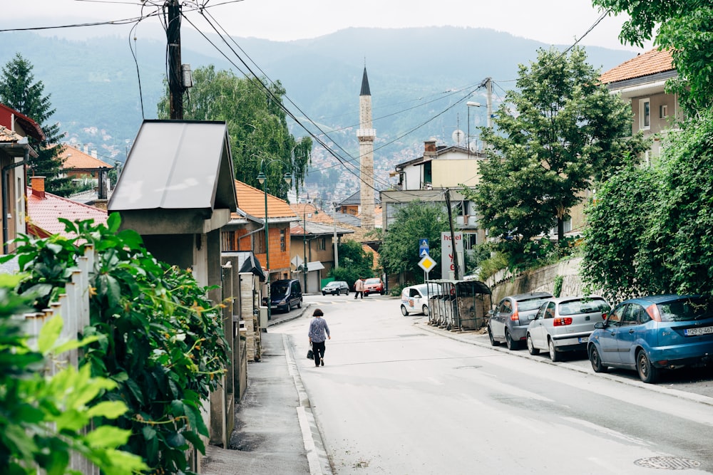 person walking on road