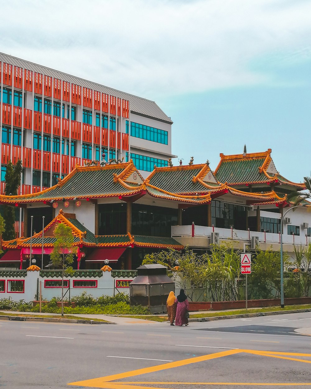 two women walking near temple