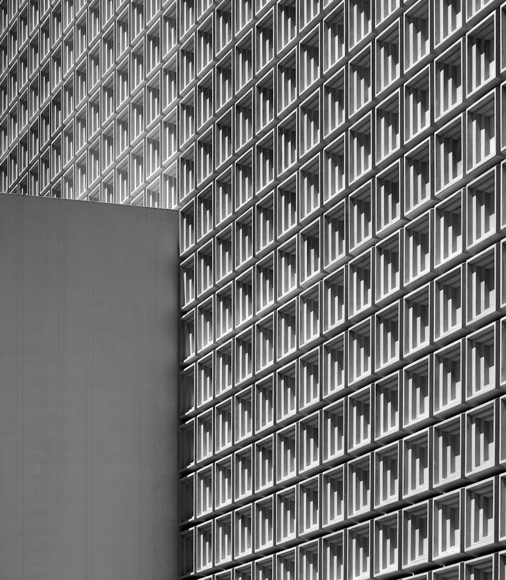 a tall building with many windows in front of it