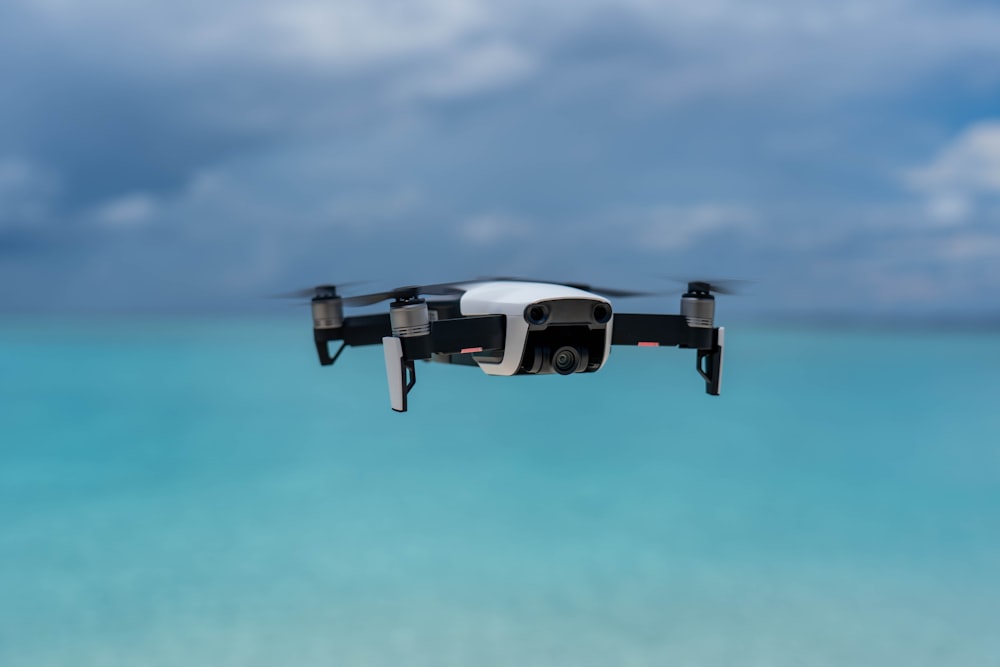 shallow focus photo of white and black drone