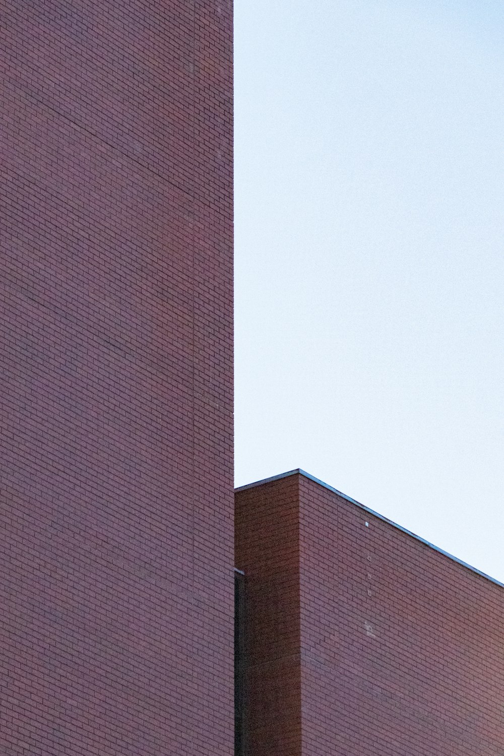 a clock on the side of a brick building