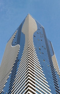 grey and blue curtain-glass building