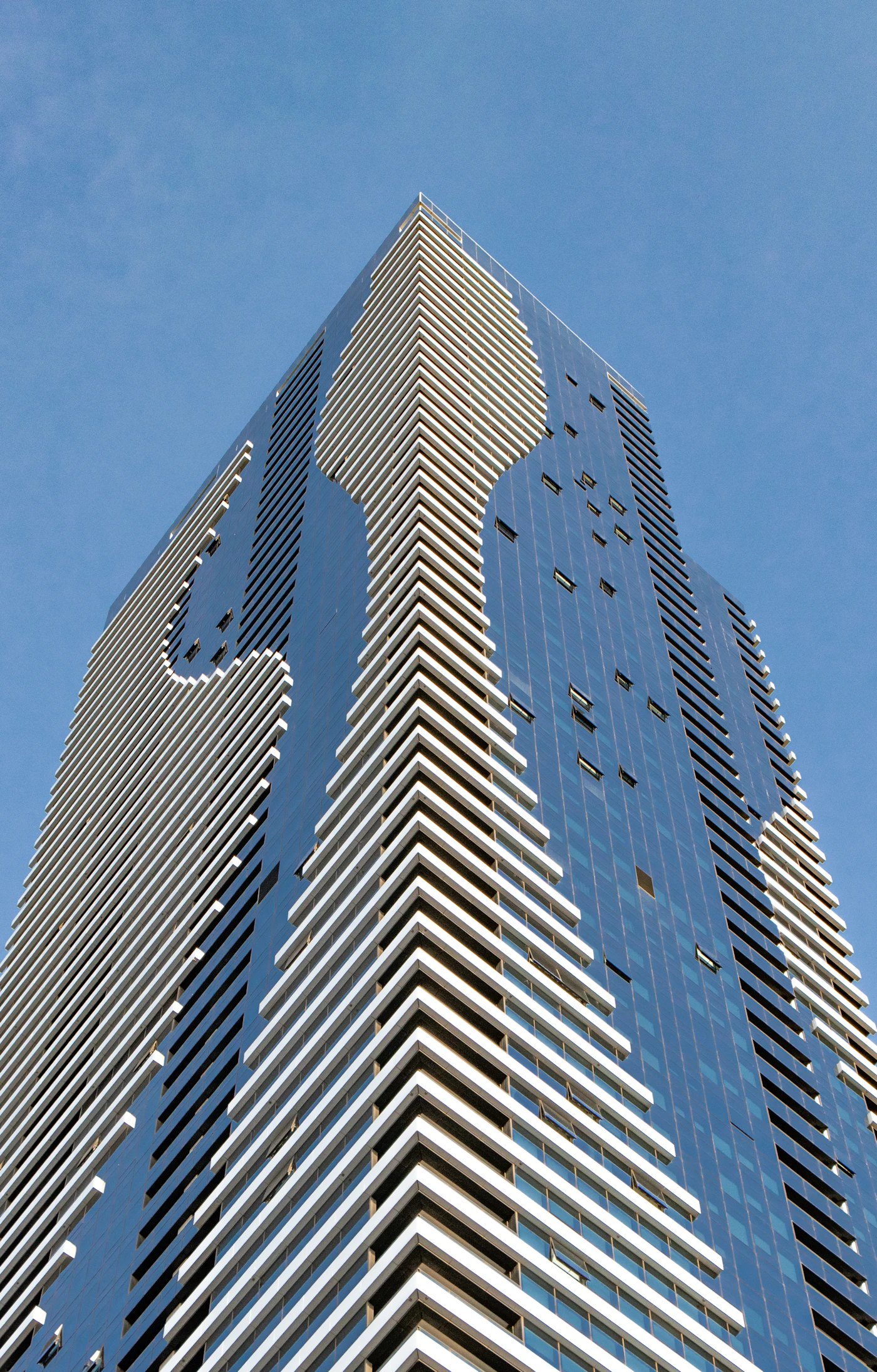 Glass and white façade of a Melbourne tower