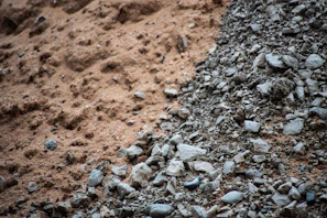 Fine sand and small pebbles blending together in a delivery truck bed