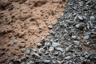 Fine sand and small pebbles blending together in a delivery truck bed
