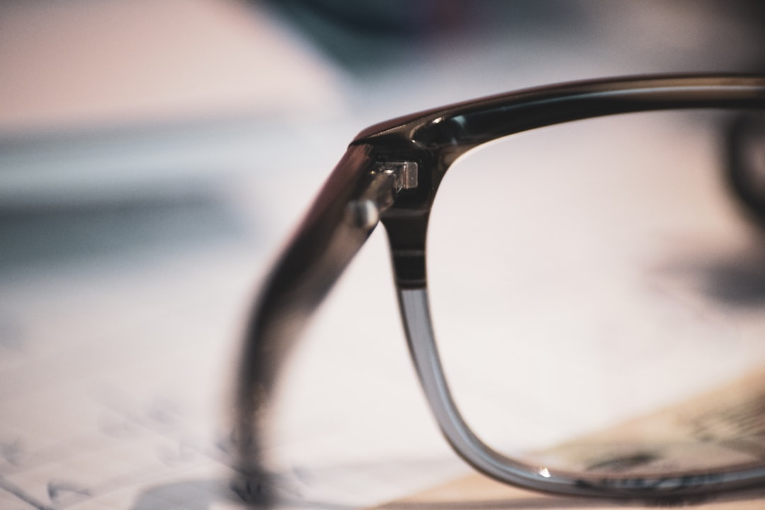 black-framed eyeglasses on gray surface