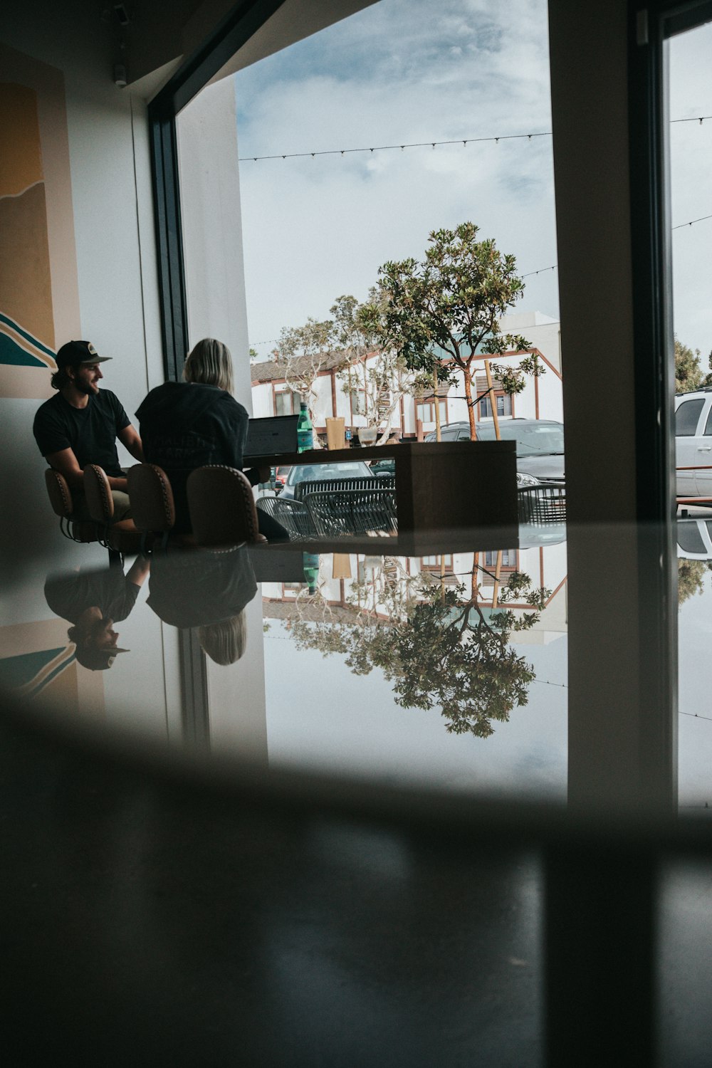 man and woman sitting on chairs