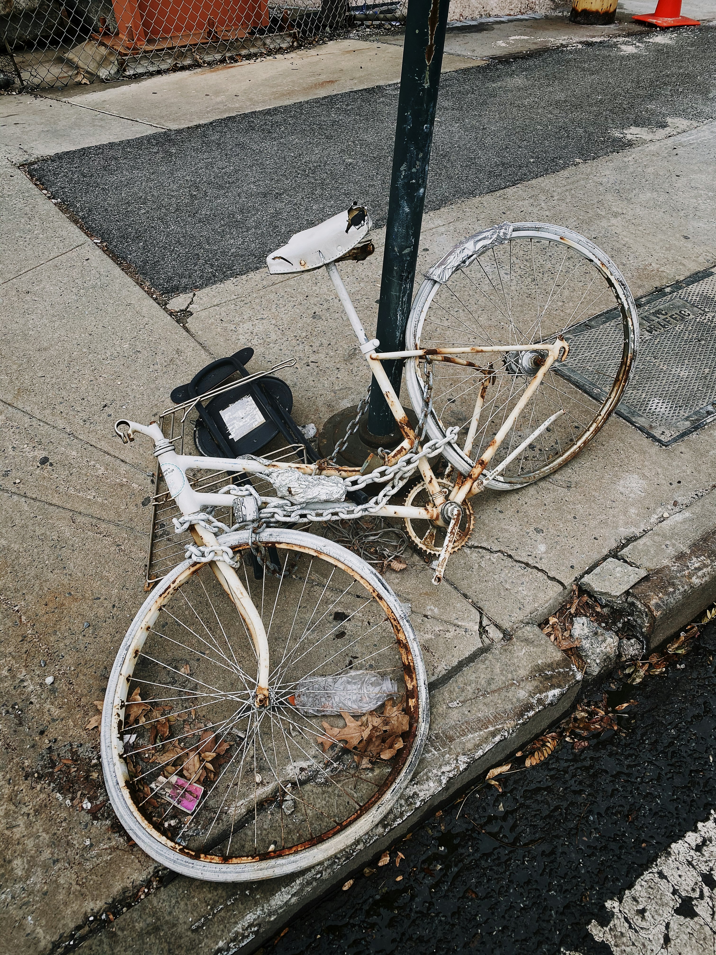 white and brown rigid bike parked on sideway