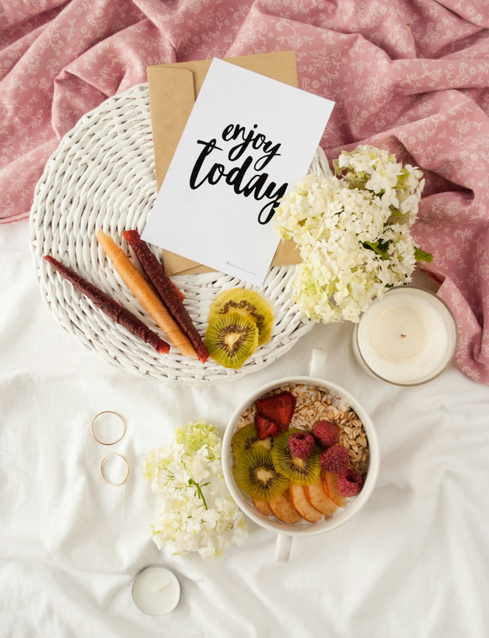 enjoy today poster on white basket beside bowl of food